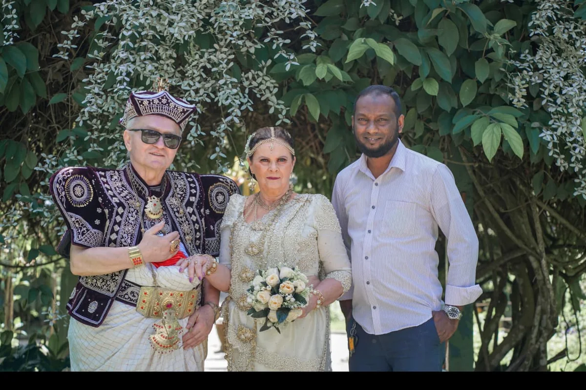 Guests wearing traditional Kandyan-style attire during a cultural photo experience